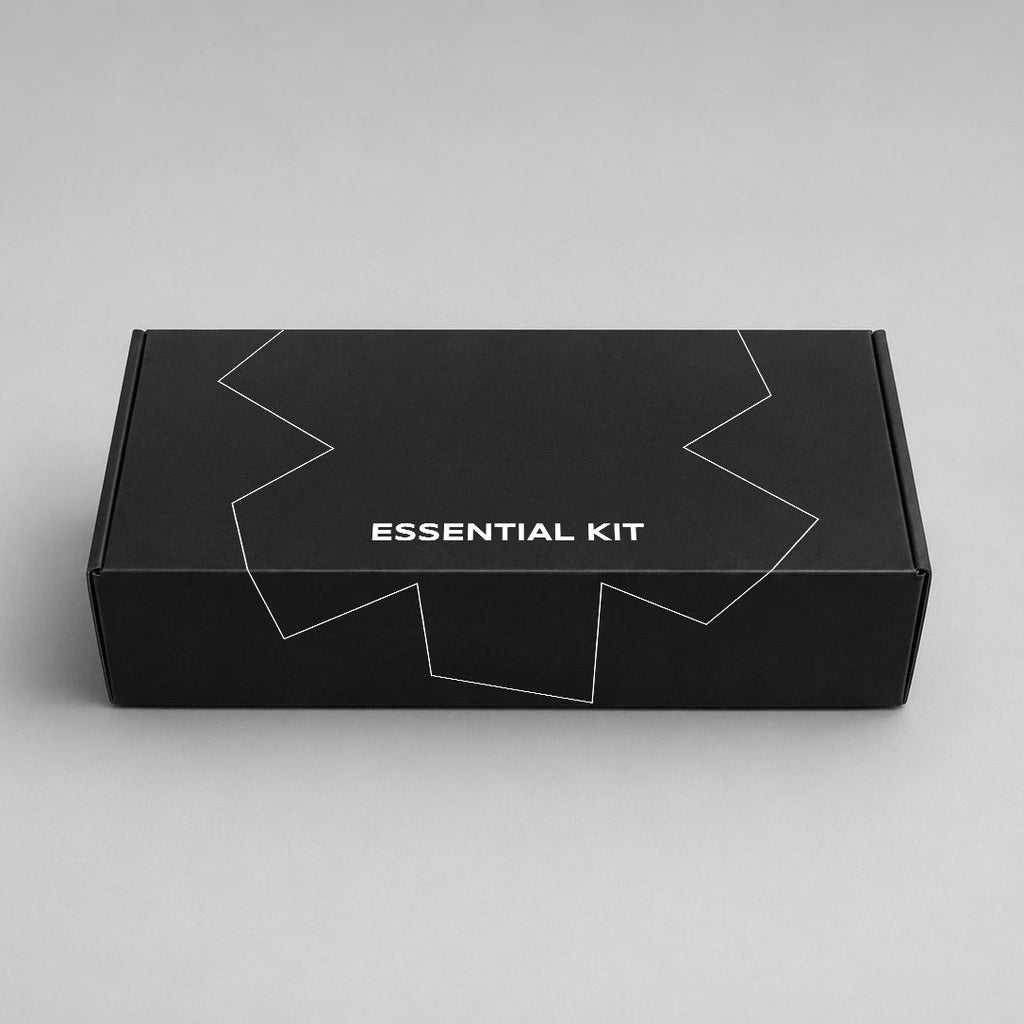 Black box labeled 'Essential Kit' on a gray background